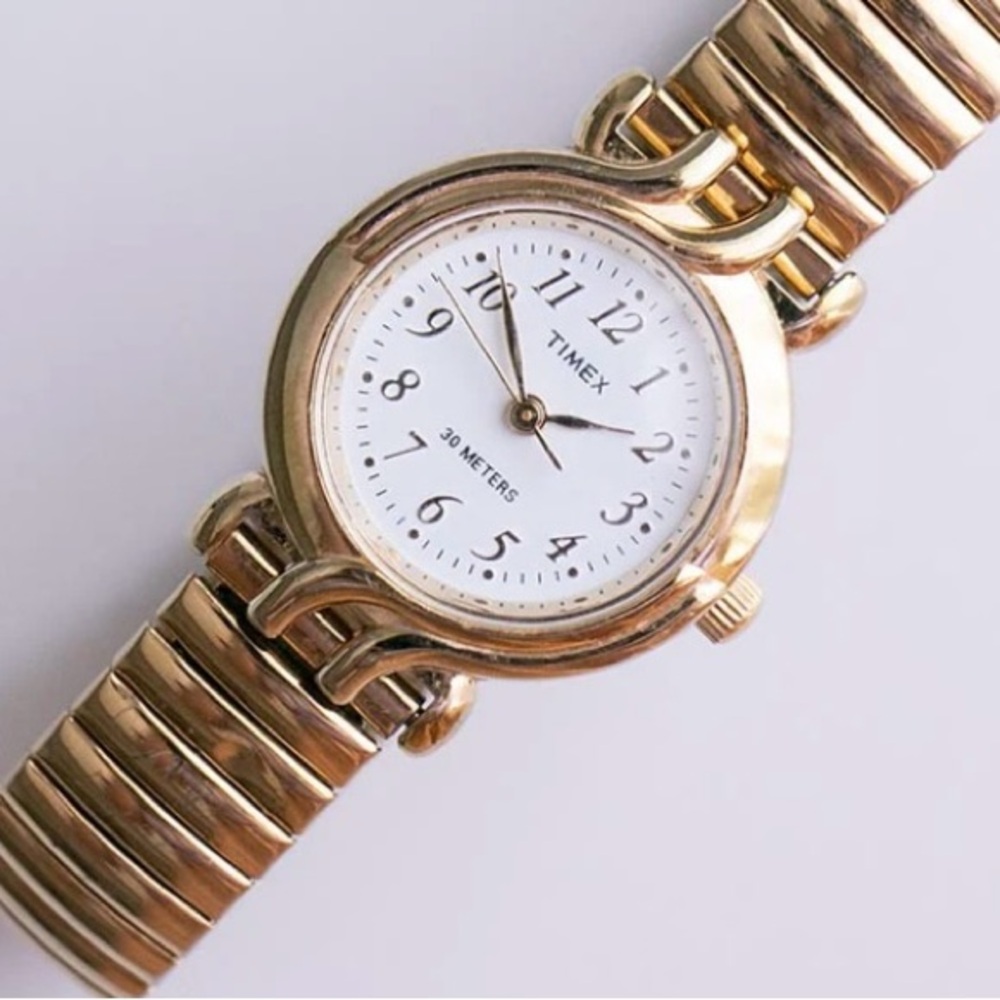 Vintage elegant Timex ladies gold watch/white face, stretch band, new battery